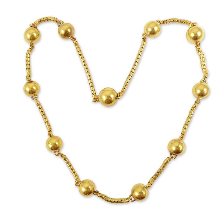 Small gold ball and snakelink chain necklace, the slim tubular chain spaced by eleven gold balls